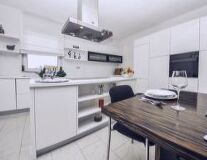 a kitchen with a sink and a counter in a room